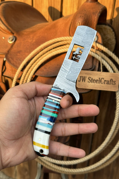 Damascus Bull Cutter Knife — Multi-Color Rainbow Resin Handle, Christian Cross Blade Engraving, Steel Bolster & Lanyard Hole