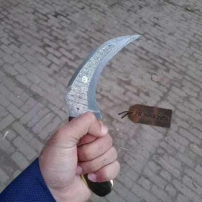 Damascus karambit knife..